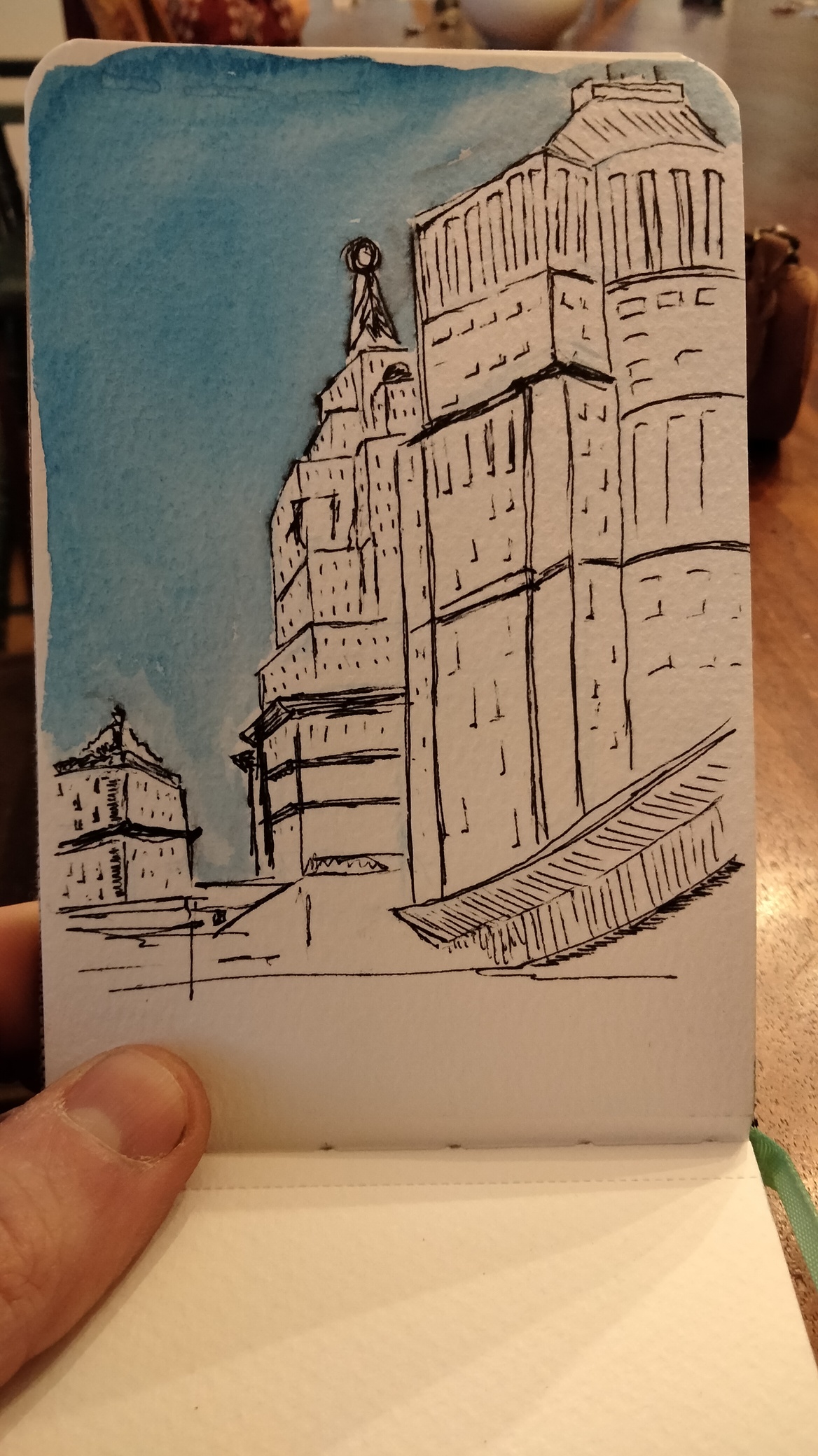 Tall buildings against a bright blue sky